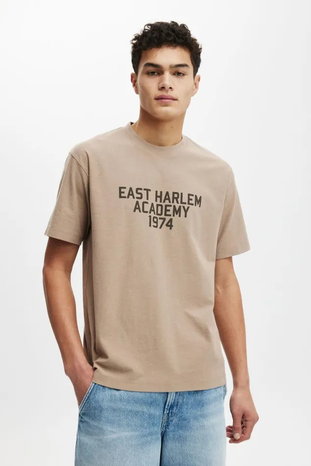 Men Tees and Tanks Cotton On Loose Fit College TShirt Taupeeast Harlem 1974
